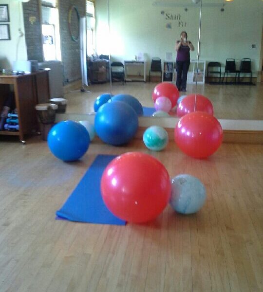 Always Balling Tammy taking picture of exercise balls in studio mirror